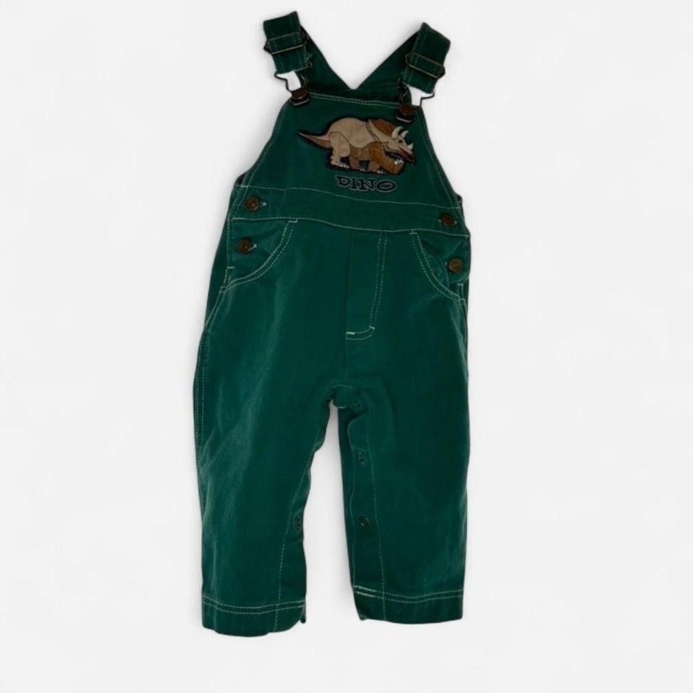 Green dinosaur overalls with adjustable straps and pockets. Size: 12 months'